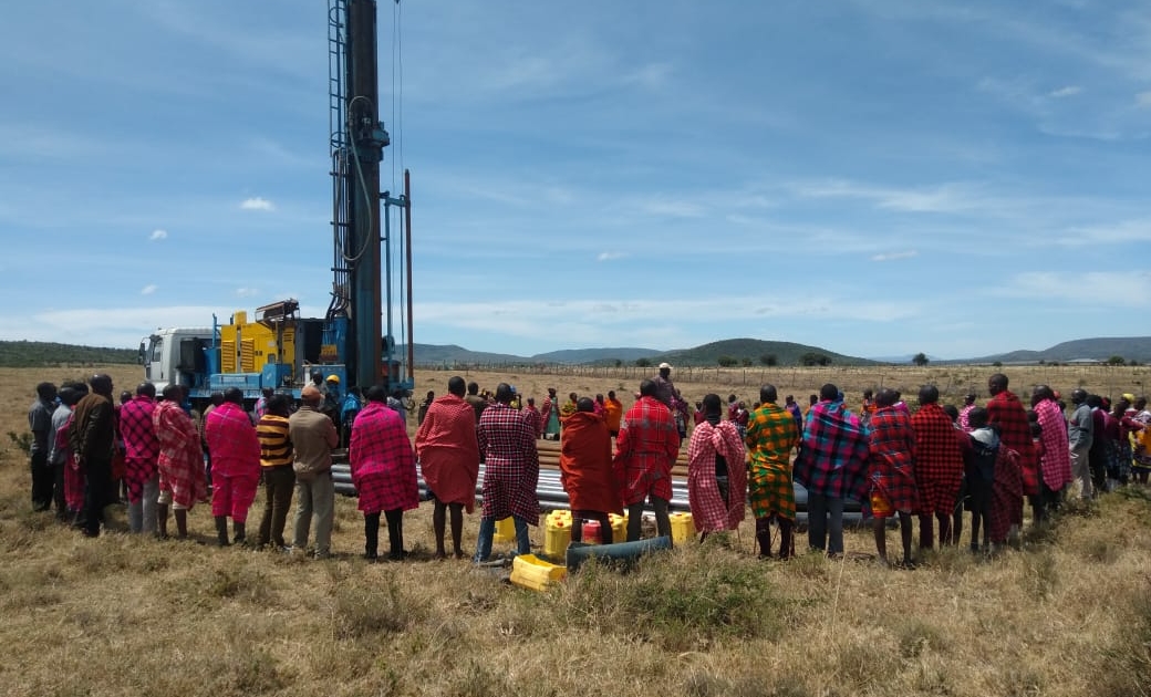 Every MOM project is steeped in prayer from the very beginning. Moving along with a community from our first exploration meeting to a completed water project typically takes about a year. During this time the community prays along with us for the project's success and that God would be glorified all the way through. We started drilling at Ildungisho Monday morning. But before the machine is started up there is a wonderful time of prayer and thanksgiving!